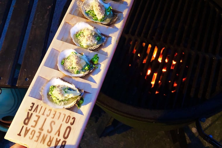 Sugar Shack oysters from the Barnegat Oyster Collective are topped with garlicky ramp butter and ready to be grilled.
