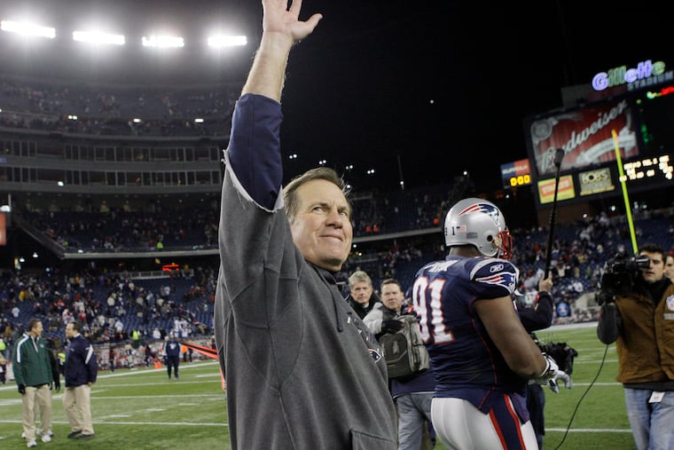 New England Patriots coach Bill Belichick waves to fans after the Patriots beat the New York Jets 31-14 in an NFL football game in Foxborough, Mass., in 2009.