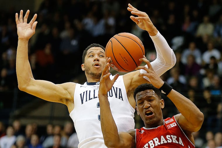 Villanova's Josh Hart and Nebraska's Andrew White III battle for a rebound.