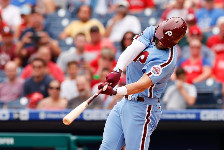Bryce Harper exited early from the second game of Thursday's doubleheader because of a stiff back.