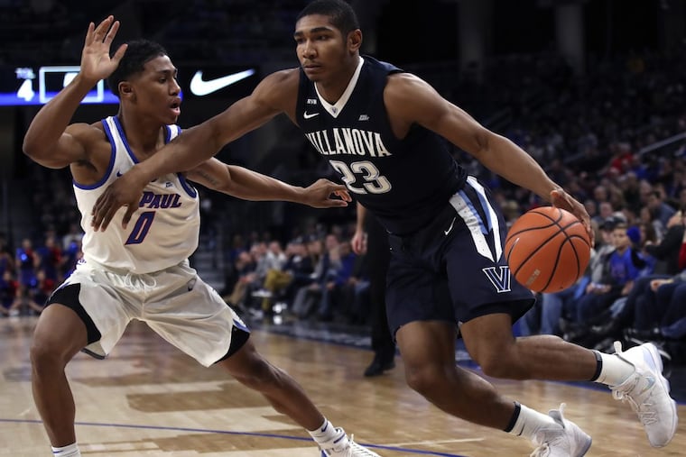 Villanova's Jermaine Samuels, right, driving against DePaul's Justin Roberts during the first half Wednesday.