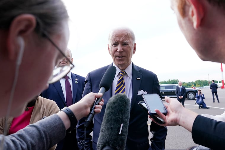 President Joe Biden speaks to the media before boarding Air Force One in Vilnius, Lithuania, on Wednesday. Biden was attending the NATO Summit.