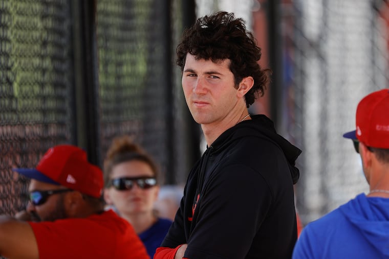 Phillies pitcher Andrew Painter watches batting practice on Tuesday in Clearwater, Fla.