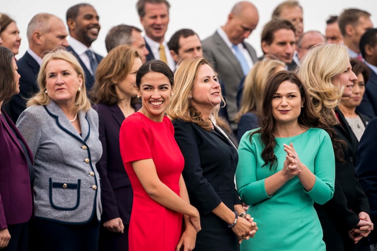 Newly elected members of Congress (from left) Sylvia Garcia (D-Texas), Alexandria Ocasio-Cortez (D-N.Y.), Debbie Mucarsel-Powell (D-Fla.), and Abby Finkenauer (D-Iowa) at a class photo in November.