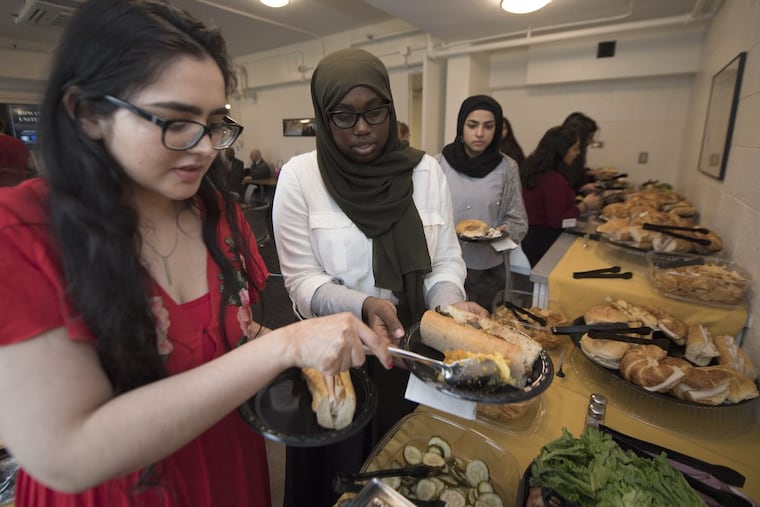 Harpreet Kaur, left, Asma Abdusshakul, center, and Ayesha Tariq, were among the students attending “Rowan United,” a dinner bringing together students of various faith at Rowan University.