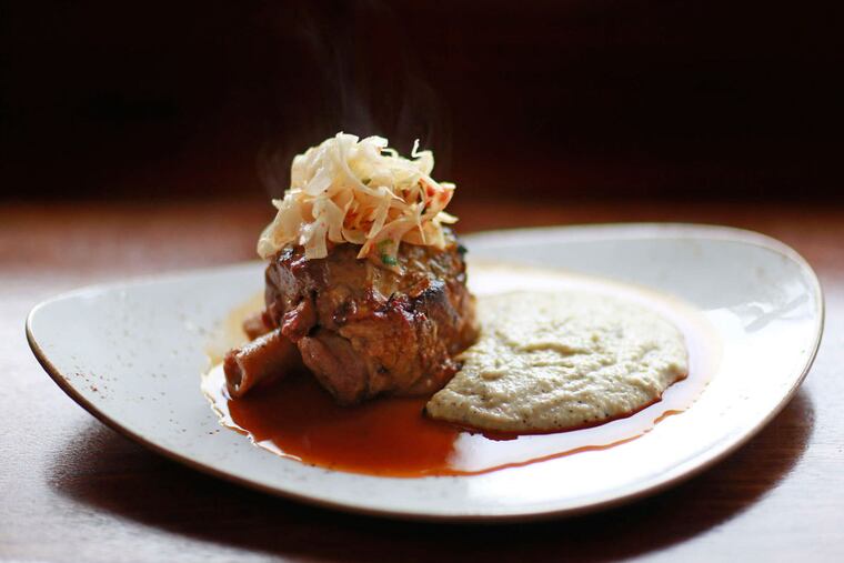 Slow-braised pork shank over buckwheat polenta enriched with taleggio at A Mano.
