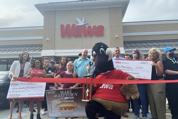 A ribbon cutting is held at the new Wawa at 418 W. Baltimore Pike, Upper Darby, on Thursday. At center, holding the "Mare of Easttown" sign, is Bucks County actress Kassie Mundhenk, who stars in the show. Behind her is Chester County Detective Christine Bleiler, who was Kate Winslet's local "go-to person" for character advice and inspiration.