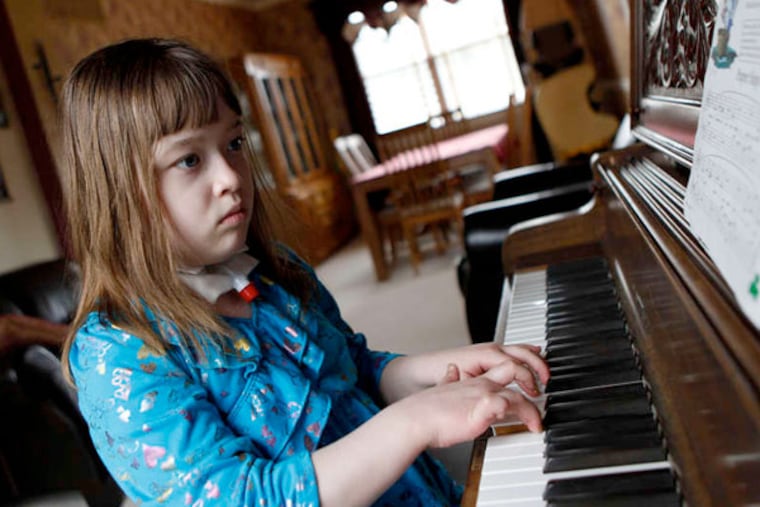 Charlotte Wendel practices piano. She endured more than two years of minimal consciousness.