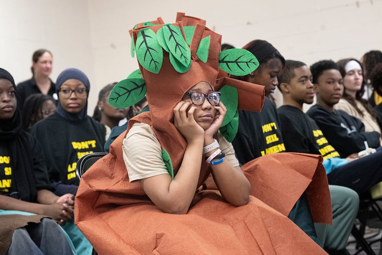 Akiraa Phillips, a ninth-grade student at Lankenau High School, listens to speakers during a gathering to support the efforts to fight closing recommendations, Wednesday, March 4, 2026, in Philadelphia.