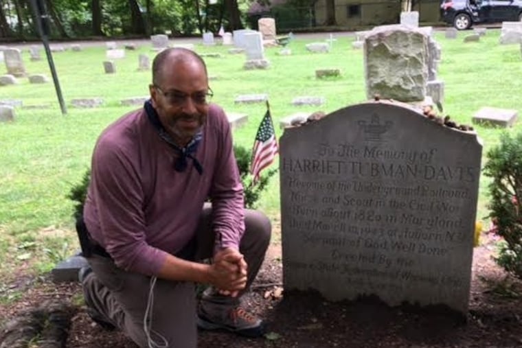Ken Johnston, Philadelphia's "Walking Artist," kneeling at Harriet Tubman's grave in Auburn, N.Y. on Aug. 9. Johnston began a 450-mile walk from New York to Canada on July 14, as part of this year being the 200th anniversary of Tubman's birth in March 1822. Tubman lived the last 54 years of her life in Auburn, where she died March 10, 1913 at age 90 or 91. Her exact birth date is unknown.