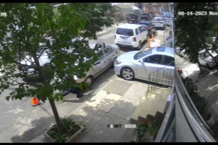 A sequence of images spanning 3 seconds of a surveillance video released by a lawyer for the family of Eddie Irizarry, show Officer Mark Dial approaching Irizarry’s Toyota Corolla in the100 block of East Willard Street with his gun drawn and then shooting Irizarry through the window, in Kensington on Monday Aug.14, 2023