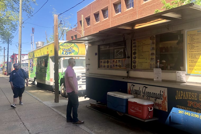 Food trucks along 12th Street near Norris Street on Temple University's campus.