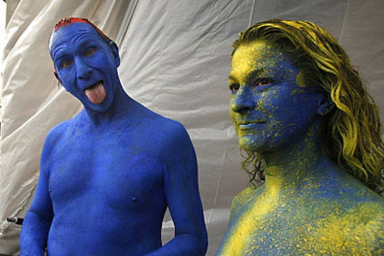 Two unidentified cyclists who joined in the ride in full body paint. (Ron Cortes / Staff Photographer)