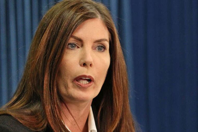 Pennsylvania Attorney General Kathleen Kane explains a point to a reporter about Case File No. 36-622 during her press conference in Harrisburg on Monday. Attorney General Kathleen Kane makes her first public appearance after The Inquirer reports that she shut down an undercover investigation that captured five Philadelphia Democrats on tape. She says the investigation was flawed and a criminal case would not have succeeded in court. 03/17/2014 ( MICHAEL BRYANT / Staff Photographer )