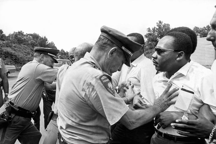 Dr. Martin Luther King Jr. being shoved by a Mississippi patrolman during March Against Fear in 1966. It’s been 50 years since King was killed. What’s changed?