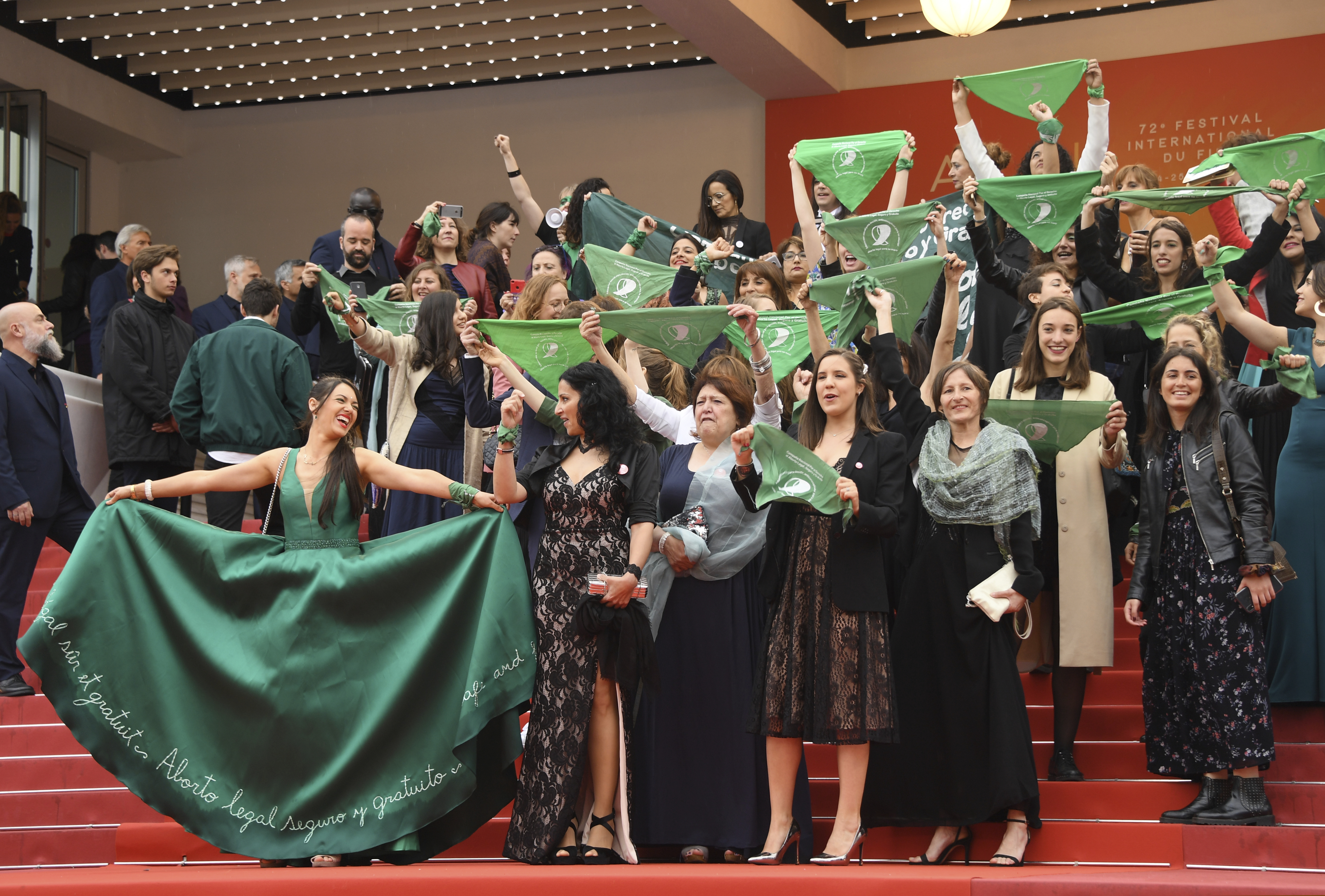 Cast and crew of the film 'Let it be Law' demonstrate for the legalization of abortion in Argentina upon arrival at the premiere of the film 'The Wild Goose Lake' at the 72nd international film festival, Cannes, southern France, Saturday, May 18, 2019.