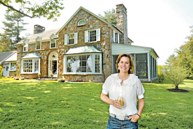 Kathleen Penney stands in front of her newly renovated home in West Chester. (Clem Murray / Staff Photographer)