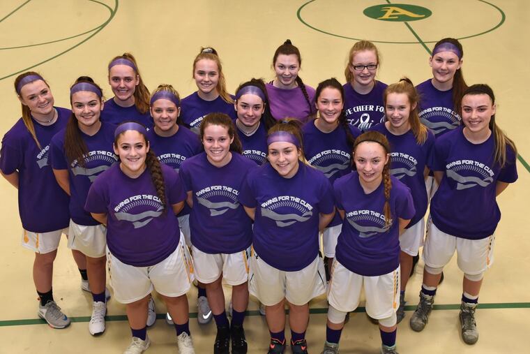 The Audubon girls’ basketball team wear purple T-shirts at practice in memory of their teammate Kari Jenkinson, a three-sport athlete who died on Jan. 4 after a two-year battle with brain cancer.