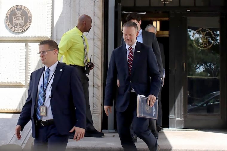 United States trade representative Jamieson Greer (center) leaves the U.S. Department of Commerce following a meeting with Canadian officials Monday in Washington.