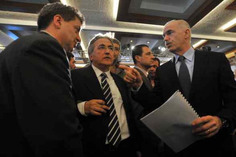 George Papandreou (right) with labor's Guy Ryder (left) and Yiannis Panagopoulos. Unions have held two demonstrations in Athens this month to protest government austerity measures.