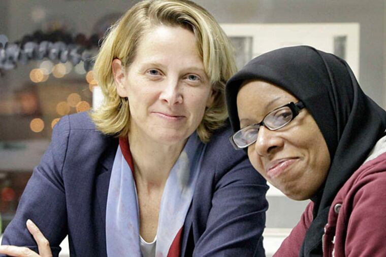 Mariana Chilton (left) and Shearine McGhee. 'One person alone doesn't have a voice,' McGhee said. 'But together, we can sing a song.' (Elizabeth Robertson/Staff)