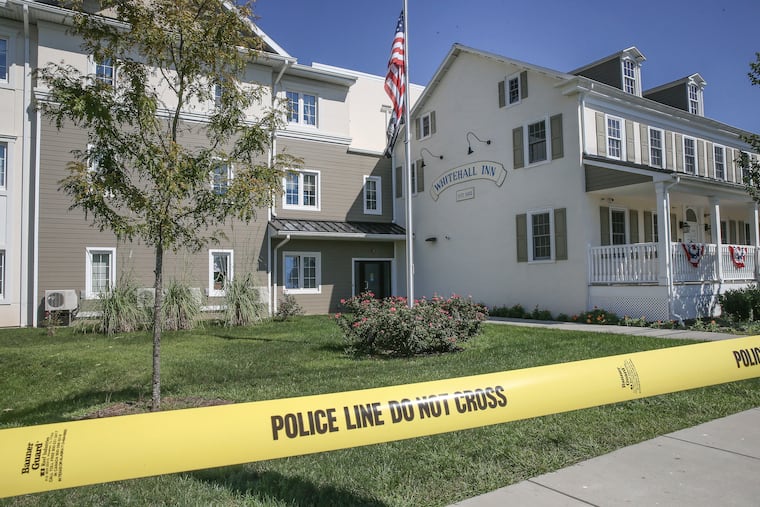 Police say a woman shot a neighbor and then herself at the Whitehall Apartments, a 48-unit complex for veterans in Chester County.