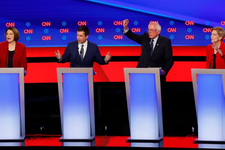 Sen. Amy Klobuchar, D-Minn., from left, South Bend Mayor Pete Buttigieg, Sen. Bernie Sanders, I-Vt., and Sen. Elizabeth Warren, D-Mass., participate in the first of two Democratic presidential primary debates hosted by CNN Tuesday, July 30, 2019, in the Fox Theatre in Detroit. (AP Photo/Paul Sancya)