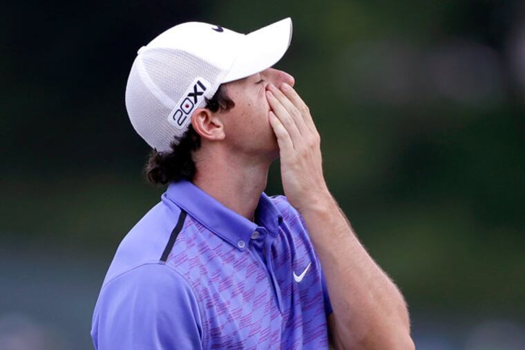 Rory McIlroy, of Northern Ireland, reacts after putting on the 15th green during the third round of the U.S. Open golf tournament at Merion Golf Club, Saturday, June 15, 2013, in Ardmore, Pa. (Darron Cummings/AP)