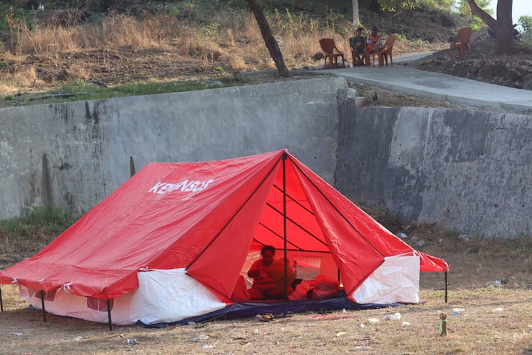 Rescuers in Indonesia recover 6 more bodies in earthquake aftermath, raising death toll to 53 Rescuers in Indonesia recover 6 more bodies in earthquake aftermath, raising death toll to 53