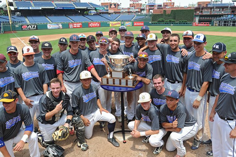 The Suburban One League National team surrounds the Carpenter Cup
after beating Jersey Shore 12-6 June 23, 2015 to win the championship
at Citizens Bank Park. ( CLEM MURRAY / Staff Photographer )