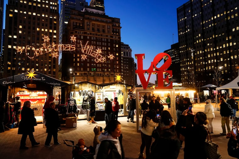 Shoppers visit the Christmas Village in Philadelphia on Dec. 13, 2023.