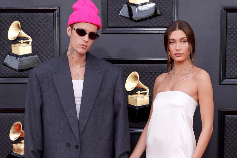 Justin Bieber, left, and Hailey Bieber attend the 64th Annual Grammy Awards in 2022.