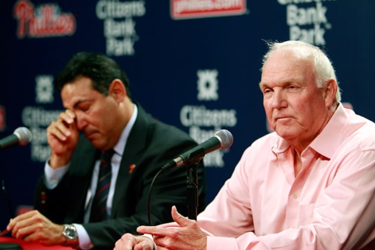 While Phillies manager Charlie Manuel is announcing his thought to leaving managerial job, general manager Ruben Amaro Jr. is wiping tears during the Press conference on Friday, Aug.16, 2013( AKIRA SUWA / Staff Photographer )
