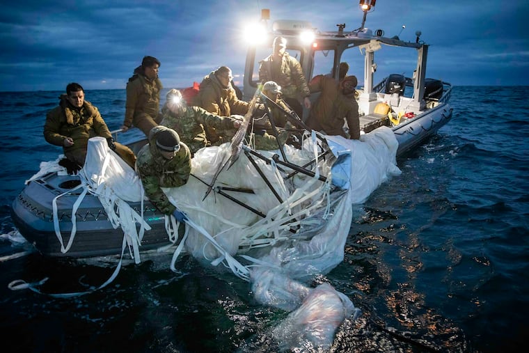 Sailors assigned to Explosive Ordnance Disposal Group 2 recover a high-altitude surveillance balloon off the coast of Myrtle Beach, S.C., last week.