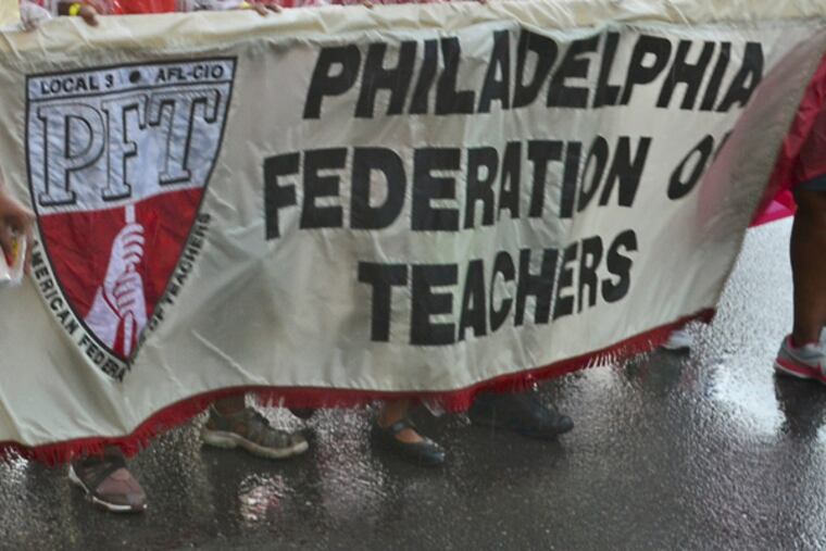 Members, family and friends of the Philadelphia Federation of Teachers march along Columbus Blvd. September 2, 2013, in the Philadelphia Council AFL-CIO's 26th annual Tri-State Labor Day Parade and Family Celebration. File. ( TOM GRALISH / Staff Photographer )