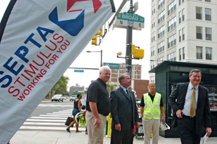 SEPTA General Manager Joseph Casey (right) was at the groundbreaking at the subway stop at Broad and Spring Garden Streets with assistant GM Francis Kelly (second from left) and construction company chief James J. Anderson. (Clem Murray / Staff Photographer)
