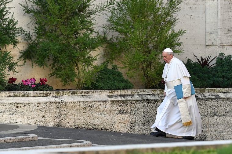 Pope Francis arrives for the opening of a sex abuse prevention summit Thursday at the Vatican.