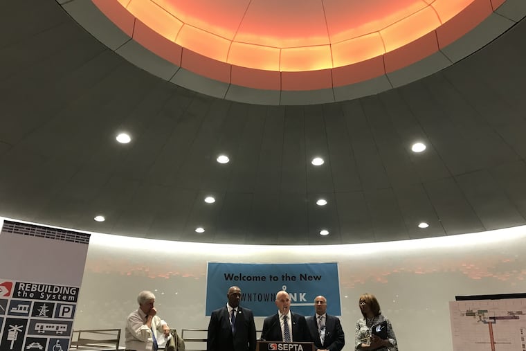 SEPTA's general manager unveils the redesign of the tunnels beneath City Hall, flanked (L-R) by Paul Levy, president of the Center City District, U.S. Rep. Dwight Evans, and City Council member Mark Squilla.