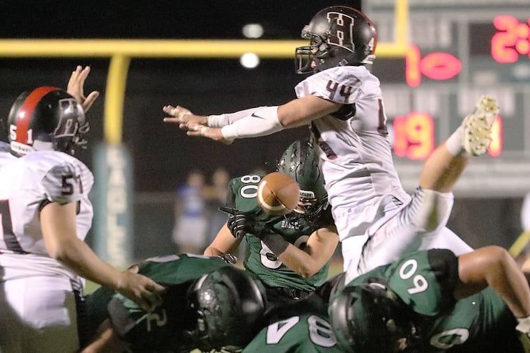 Mike Bilodeau's field goal kick is blocked by Haddonfield’s Will Ciemny during the 2nd quarter.