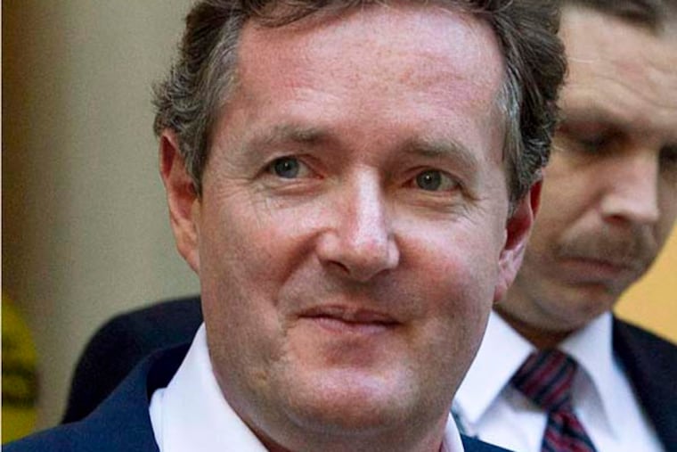 FILE - In this Dec. 20, 2011 file photo, Piers Morgan, host of CNN's "Piers Morgan Tonight," leaves the CNN building in Los Angeles. More than 31,400 people have signed a petition calling for British CNN host Piers Morgan to be deported from the U.S. over his gun-control views. Morgan has taken an aggressive stand for tighter U.S. gun laws in the wake of the Newtown, Conn., school shooting. Last week, he called a gun advocate appearing on his "Piers Morgan Tonight" show an "unbelievably stupid man." Now, gun-rights activists are fighting back. A petition created Dec. 21 on the White House e-petition website by a user in Texas accuses Morgan of engaging in a "hostile attack against the U.S. Constitution" by targeting the Second Amendment and demands he be deported immediately. (AP Photo/Jae C. Hong, File)