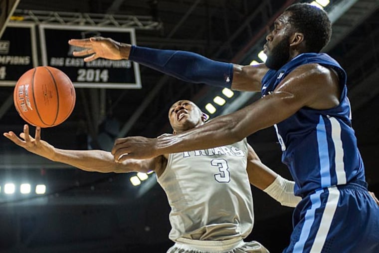 Villanova Wildcats forward Daniel Ochefu (23) blocks the shot of Providence Friars guard Kris Dunn (3) during the first half at Dunkin Donuts Center. (Gregory J. Fisher/USA Today)