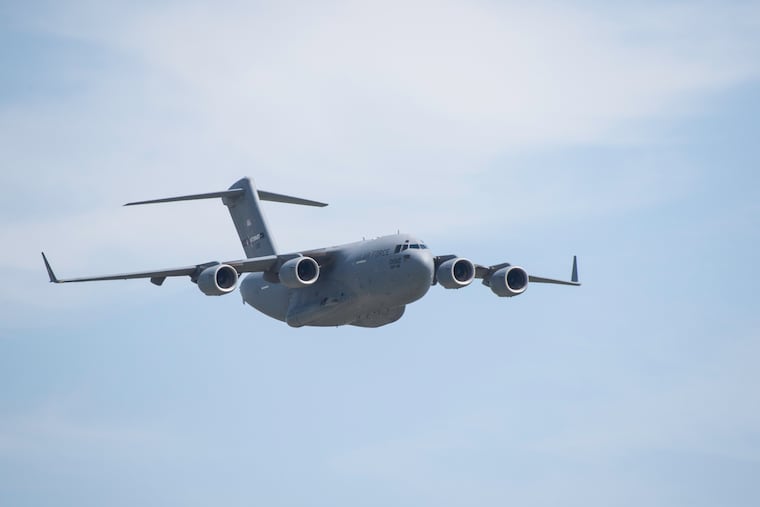 A C-17 Globemaster III Military Transport Aircraft making a low pass during a tactical flight demonstration at Thunder of Niagara Air Show
