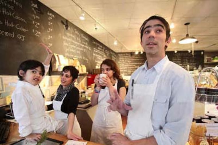 Annie Baum-Stein (second from left) and her husband, Mauro Daigle (right), opened a deli on Baltimore Avenue in the fall, inspired by an influx of young families in the neighborhood. (David M Warren / Staff Photographer)