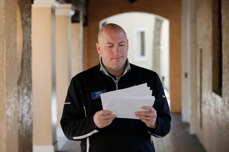 In this Tuesday, Jan. 28, 2020 photo, Leon Hayner, an associate dean of students at Rollins College looks over requests from the U.S. Census Bureau in Winter Park, Fla. Because of the federal privacy law, university administrators, if called upon, won't be able to disclose students' sex, race or Hispanic origin on the 2020 Census form. (AP Photo/John Raoux)