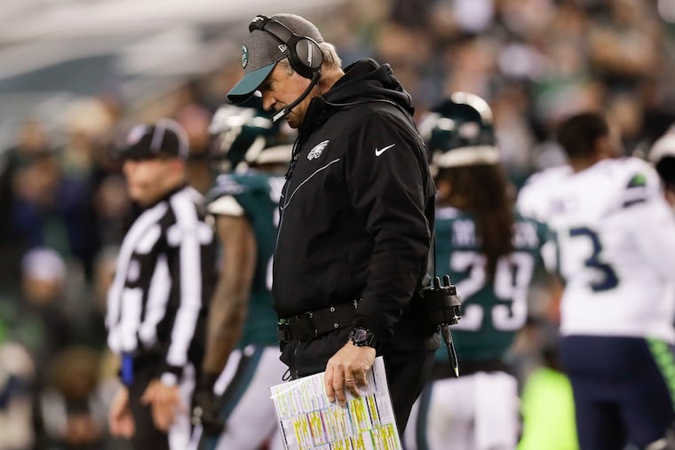 Eagles head coach Doug Pederson walks off the field after checking on injured defensive end Brandon Graham during the first-quarter against the Seattle Seahawks in a NFC Wild Card playoff game on Sunday, January 5, 2020 in Philadelphia.