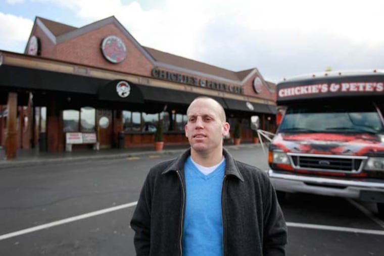 Andrew Laplante in front of Chickie's and Pete's Cafe on Packer Avenue in south Phila., February 20, 2013. ( DAVID SWANSON / Staff Photographer )