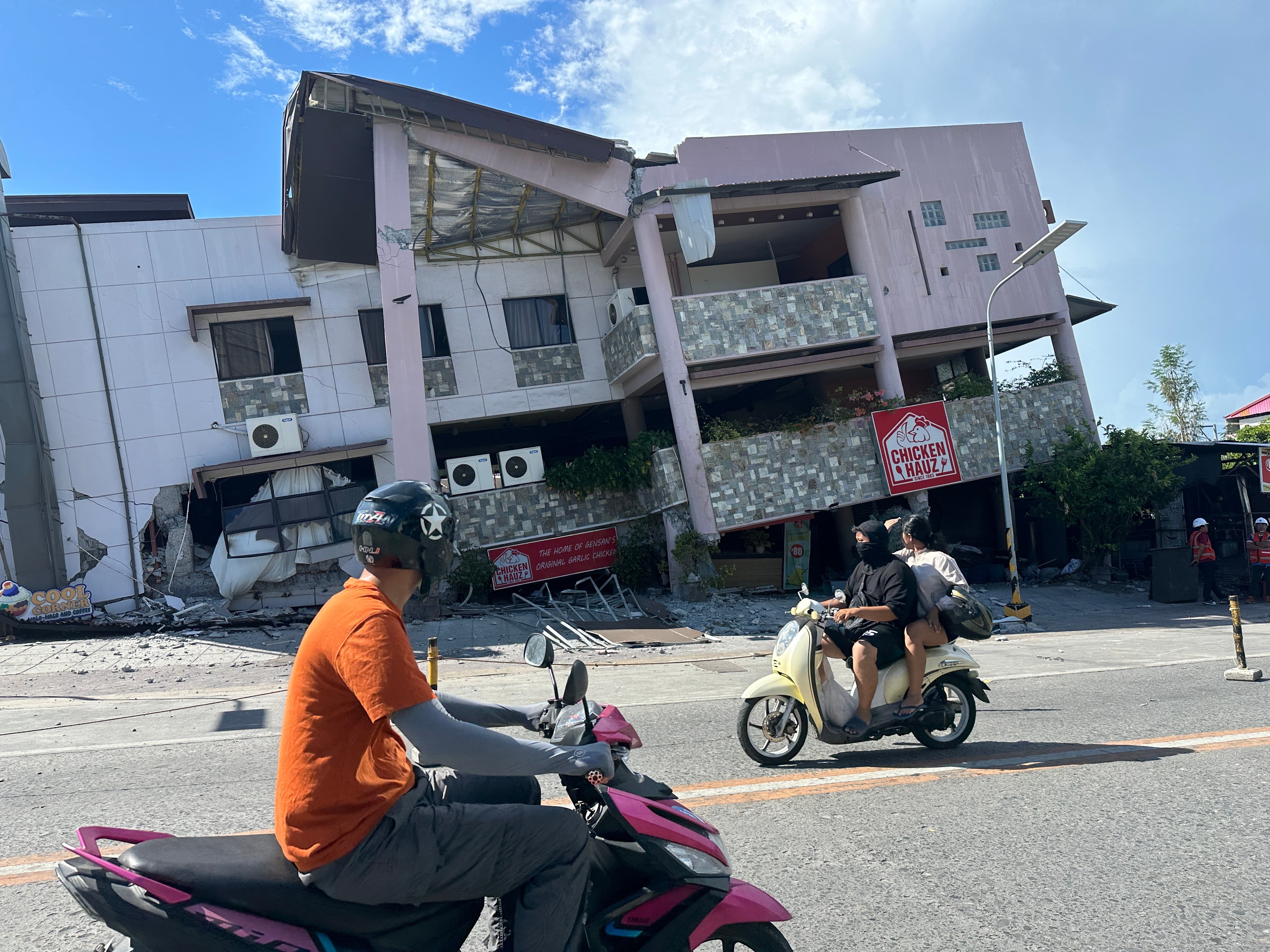 A 7.8 magnitude quake in the Philippines kills at least 32, collapses buildings and sparks tsunami