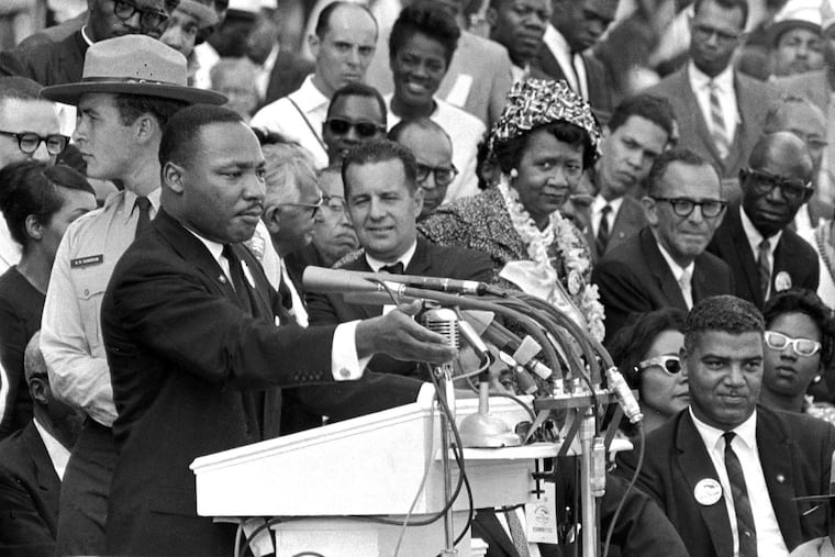FILE - The Rev. Dr. Martin Luther King Jr., delivers his "I Have a Dream" speech in Washington, Aug. 28, 1963, as National Park Service ranger Gordon "Gunny" Gundrum, left, stands beside King. (AP Photo/File)