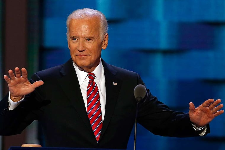 Vice President Joe Biden raises his arms before addressing delegates during Day 3 of the DNC at the Wells Fargo Center in South Philadelphia.