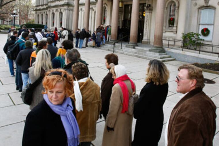 People wait in line to go into the New Jersey Statehouse Monday, Dec. 7, 2009, in Trenton, N.J. (AP Photo/Mel Evans)